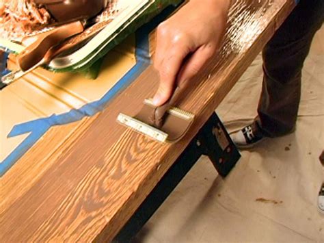 person   brush  paint  wooden table  wood planks  tape
