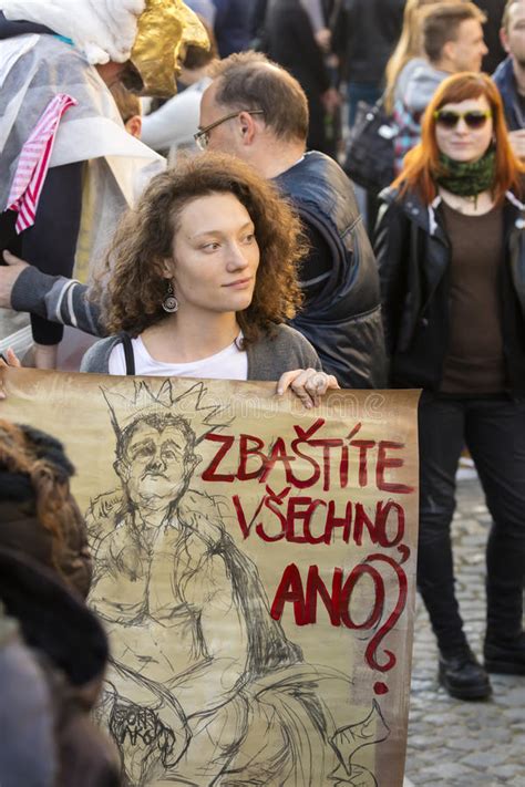 woman with poster against the president zeman attending the