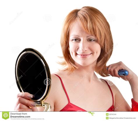 woman looking into a mirror stock images image 20761244