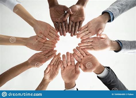close  diverse business people holding hands  circle stock photo image  community