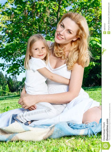 Mother Embracing Her Little Daughter Stock Image Image Of Green
