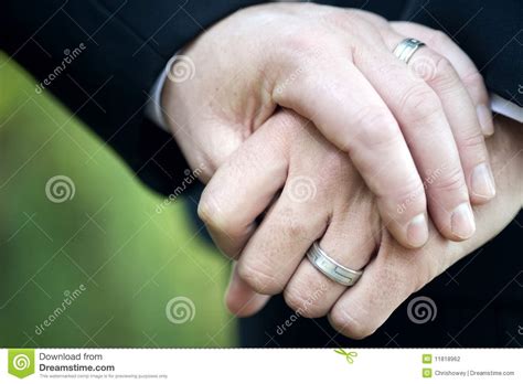 Gay Couple Holding Hands With Wedding Rings Stock
