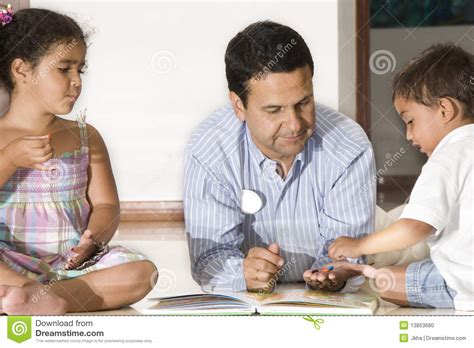 dad teaching children stock photo image