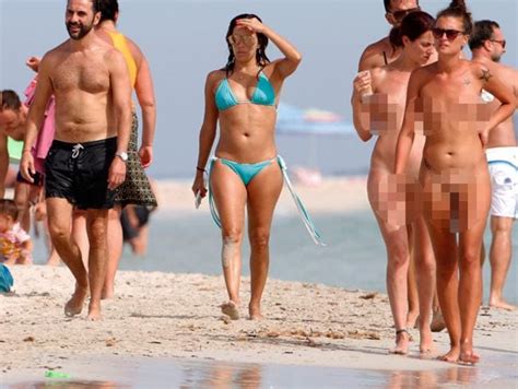 Eva Longoria Awkwardly Strolls Alongside Naked Beach Goers