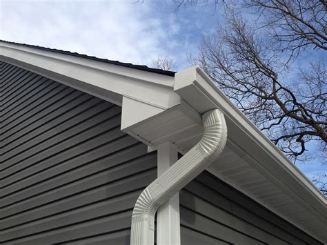 seamless gutters cost  pros cons options roi