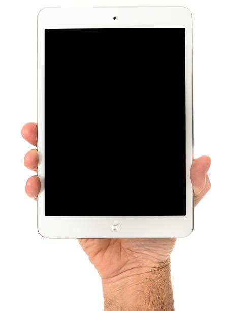 hand holding ipad mini stock  pictures royalty  images istock