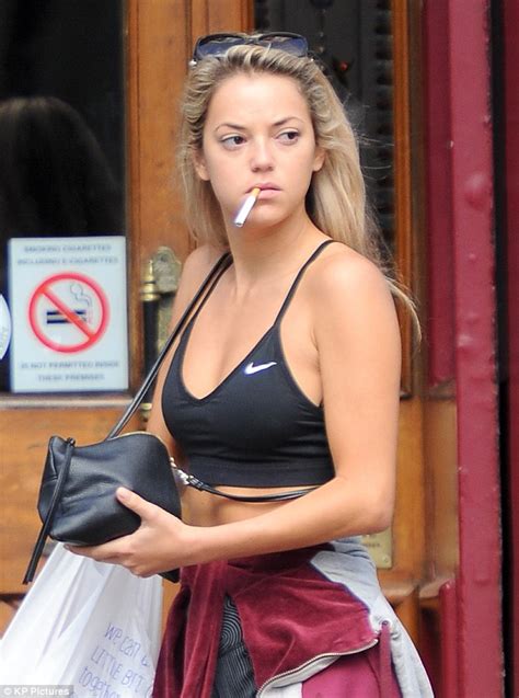 Mic S Natalie Joel Flashes Her Abs As She Puffs On Cigarette With