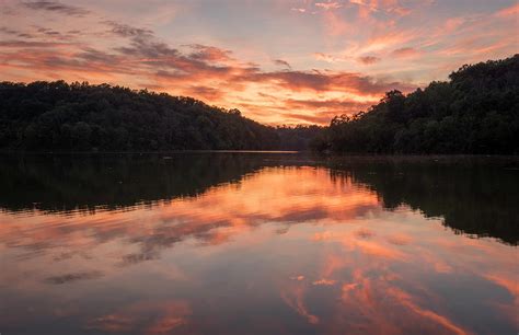 sunset on the lake of doe run in northern ky photograph by michael bowen