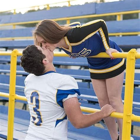football player and cheerleader kissing in the bleachers regram via