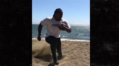 marshawn lynch intense beach training with footwork expert pounding