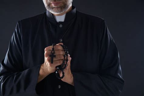 why do catholic priests wear black — catholics and bible