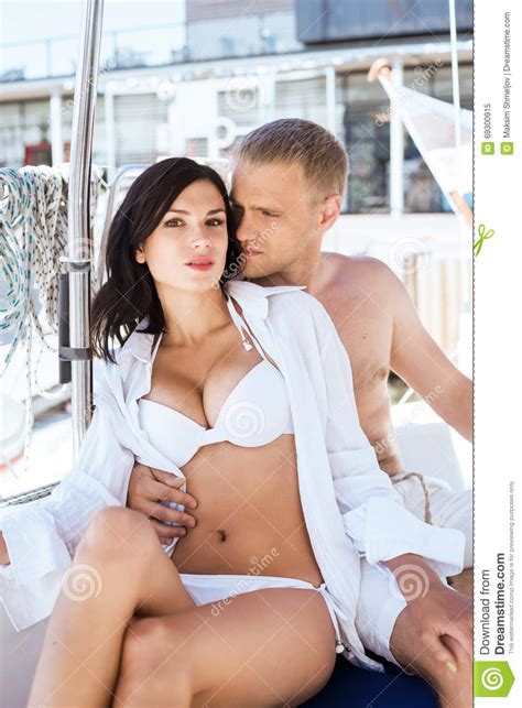 Rich Man And A Beautiful And Woman In A Swimsuit Stock Image Image Of