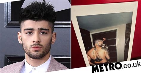 zayn malik teases something new is coming and shows off back tattoo