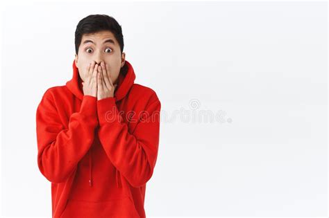 Waist Up Portrait Of Shocked Speechless Asian Man Gasping Cover Mouth