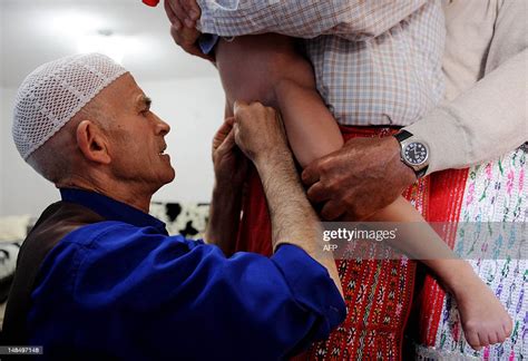 a picture taken on july 23 2011 shows a barber circumcising a muslim