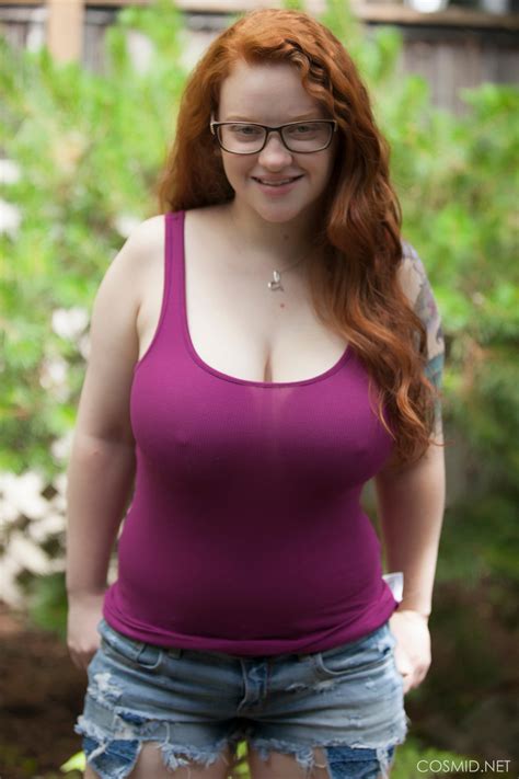 natural redhead teen exposes her thick body and big saggy boobs in the woods