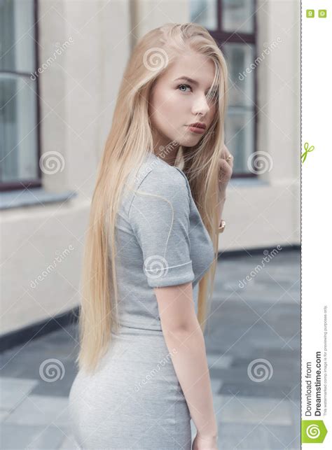 Gentle Portrait Of A Beautiful Cute Girl With Long Blond