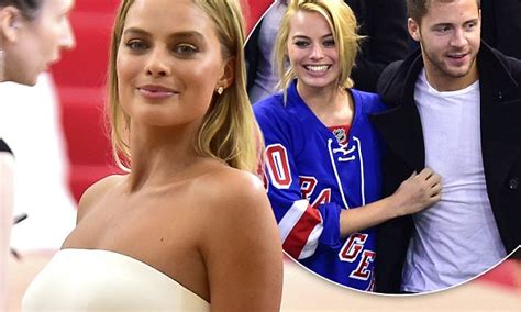 margot robbie admits she initiates groups texts if she s alone for more
