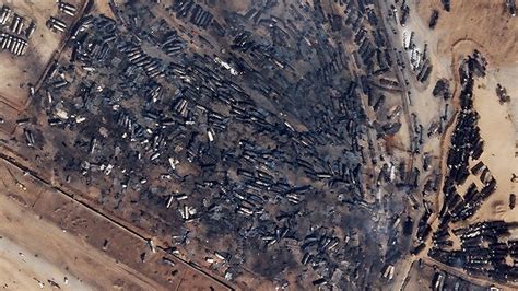 satellite images show horrible aftermath  explosion  burned hundreds  trucks  afghanistan