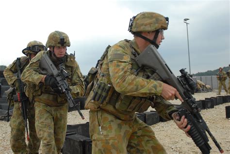 australian troops clear buildings  cooperative spirit article  united states army