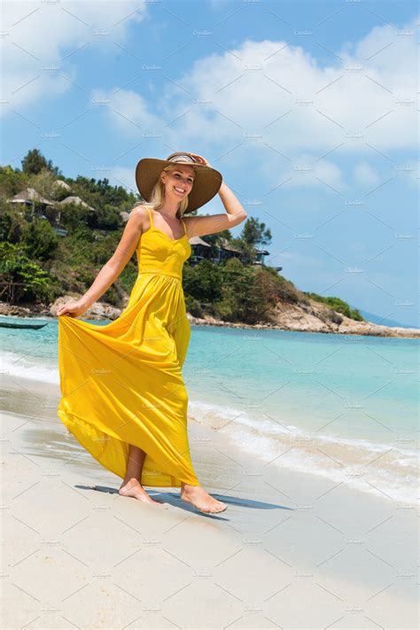 cute lady with sun hat at the beach ~ beauty and fashion