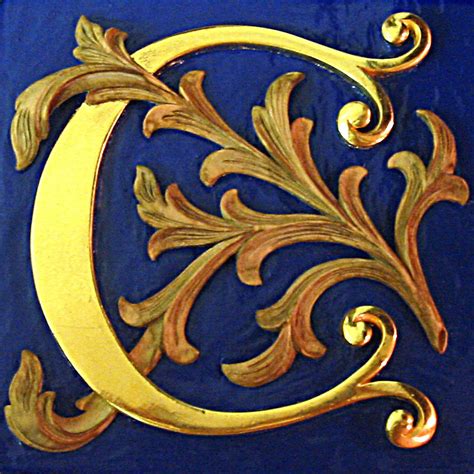 water gilded illuminated letter hand carved  lime wood carvers  gilders