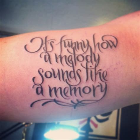 new tattoo it s funny how a melody sounds like a memory lyrics from eric church s song
