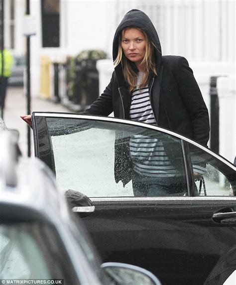 hug a hoody kate moss protects her hair as she goes shopping in