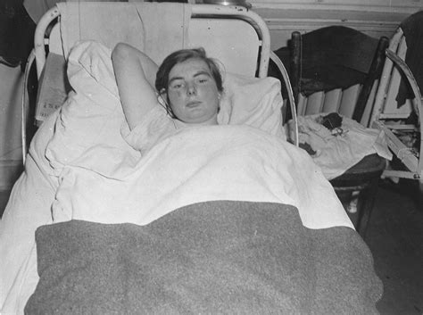 a female survivor lies in bed at the hadamar institute collections
