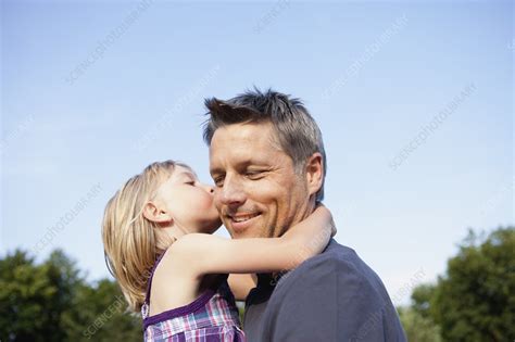 Daughter Kissing Father Stock Image F003 7994 Science Photo Library