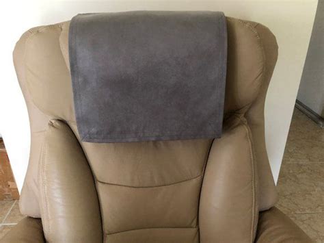 brown recliner chair   gray pillow     seat