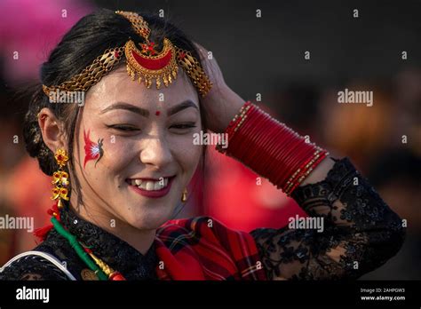 a nepalese woman dressed in a traditional attire during the celebration