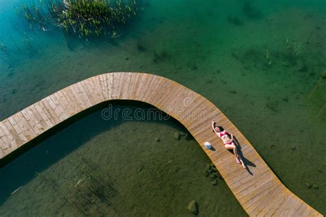 drone aerial view  young beauty woman sunbathing   sea pier stock image image  female