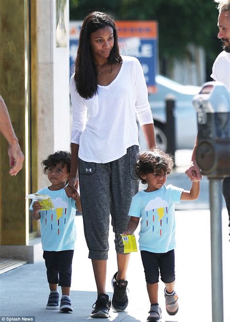 zoe saldana and husband marco take twins cy and bowie out daily mail