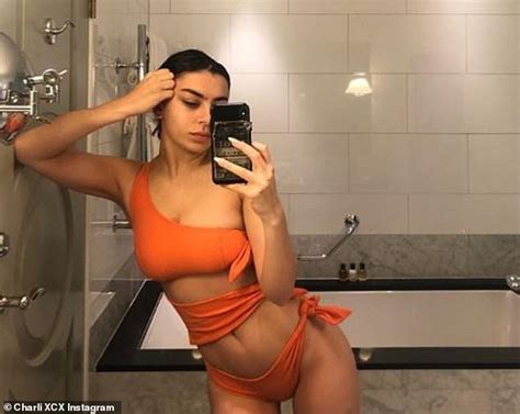 Charli Xcx Shows Off Her Sizzling Physique In Sexy Orange Swimsuit As