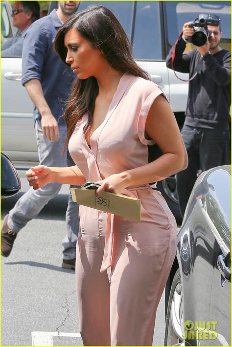 kim kardashian rocks light pink jumpsuit with partially sheer back