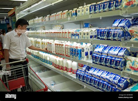 man buying milk products   carrefour supermarket  beijing china  stock photo alamy