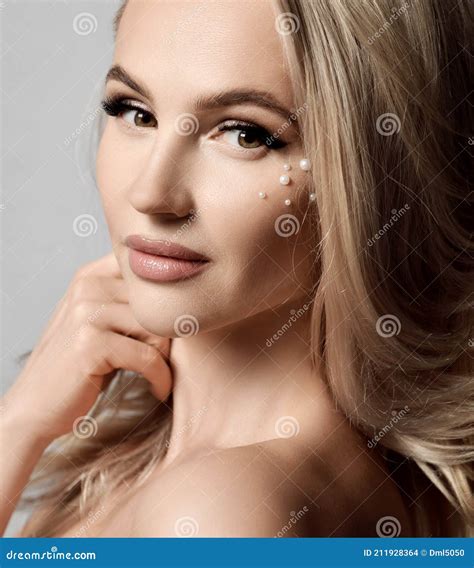 Close Up Portrait Of Young Pretty Blonde Woman With White Pearls On