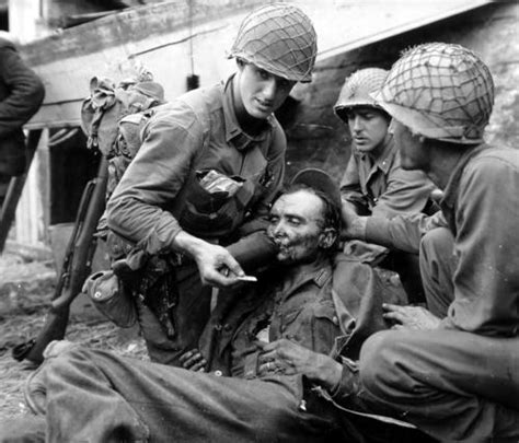 Us Army Soldiers Aiding German Soldier Man