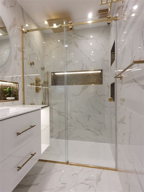 our brushed satin brass serenity frameless sliding shower enclosure