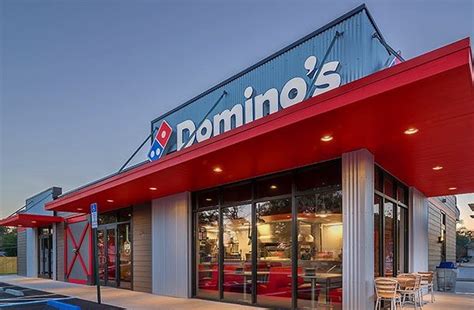 dominos franchise cost fees earning stats