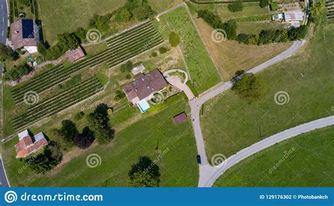 Aerial View Of House With Swimming Pool In The Countryside