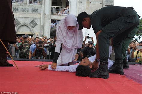 couple caned in indonesia for violating sharia law daily