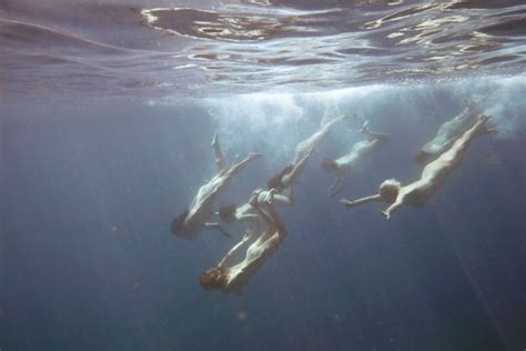 naked group swim in pristine jervis bay helps photographer