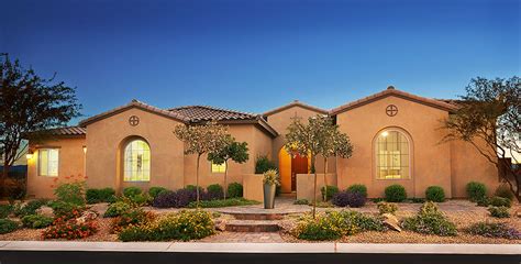 ranch style reagan home  las vegas features  sleek stucco exterior  spanish tile roof