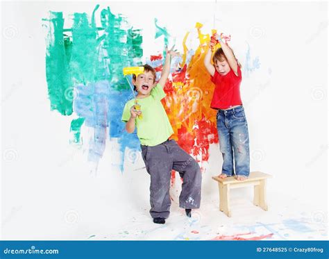 happy children painting wall  colours royalty  stock photo