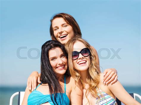 Girls Sunbathing On The Beach Chairs Stock Image Colourbox
