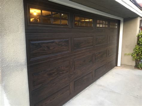 chi walnut color garage door installed  irvine cityscape garage doors