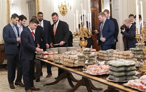 members   clemson tigers football team prepare  dine  fast food served  president