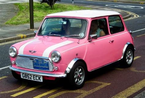 pink  white mini car driving   street